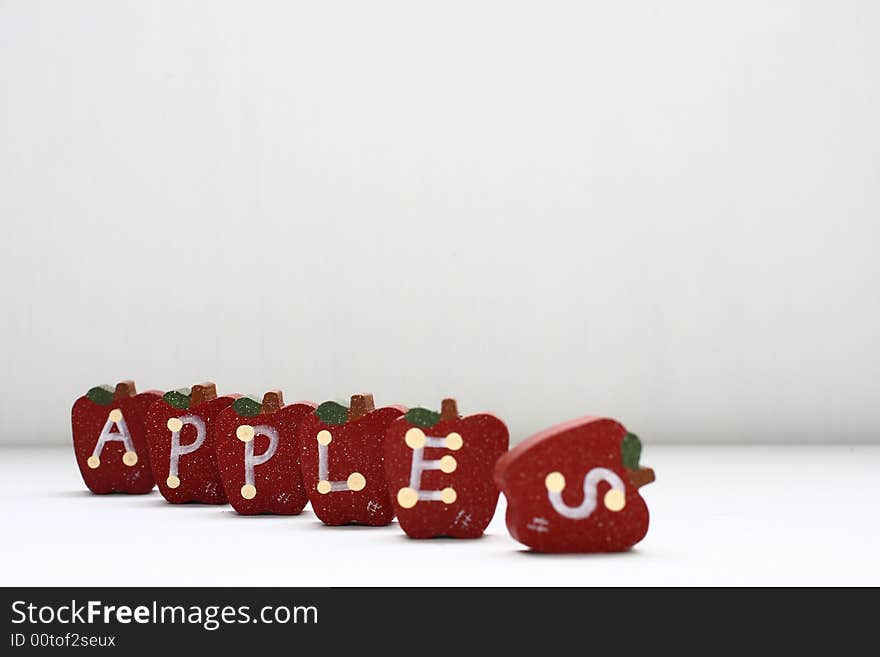 Wooden Apples with letterings spelling apples.