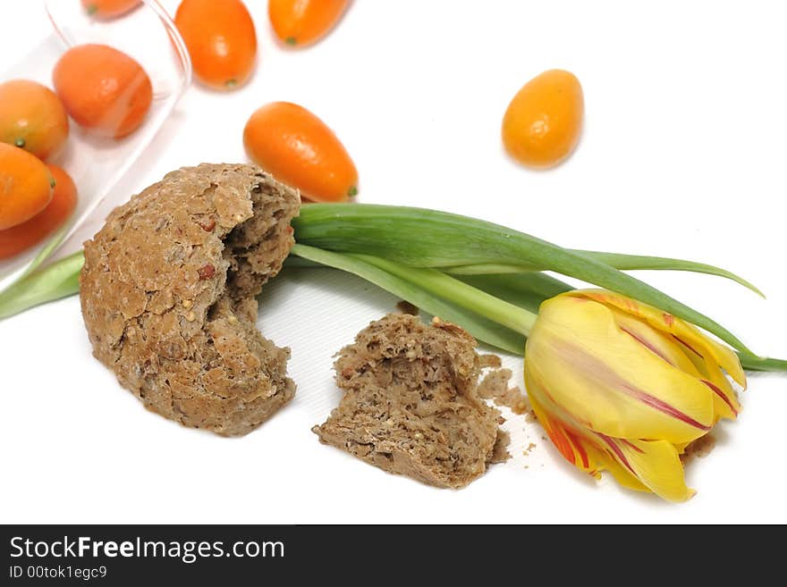 Yellow tulip and a lot of crumbs of bread. Yellow tulip and a lot of crumbs of bread