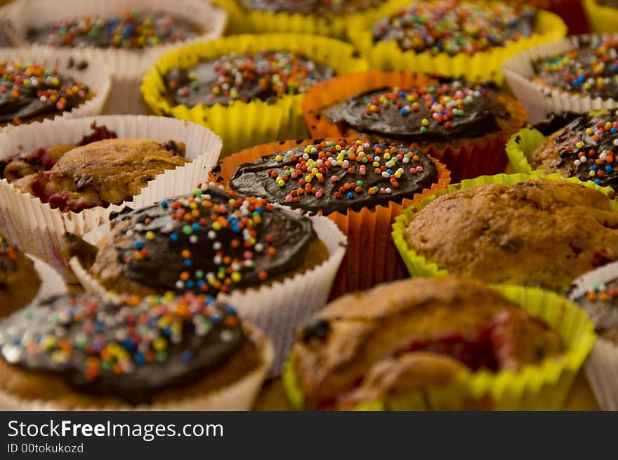 A lot of muffins with sugar peals