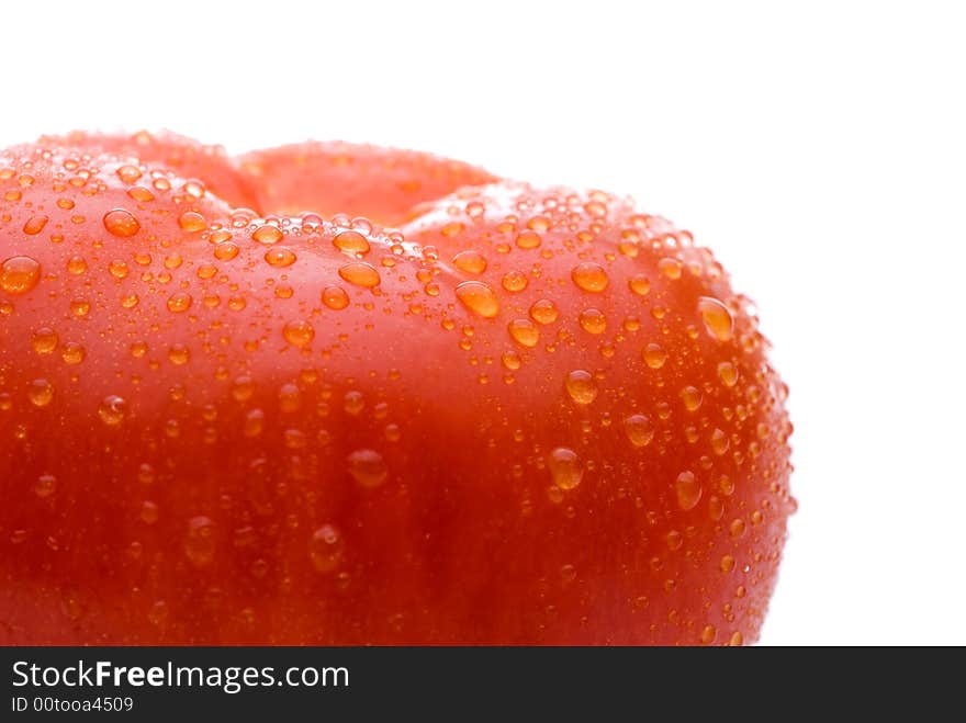 Macro of a fresh red tomato on a white background