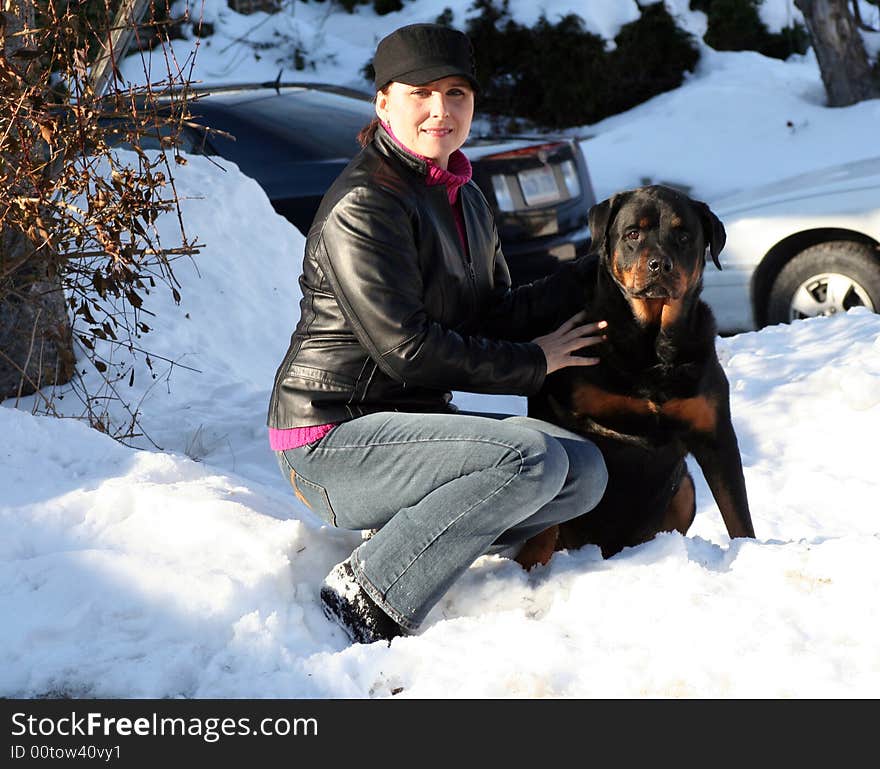 Woman and her dog, license plate blurred out