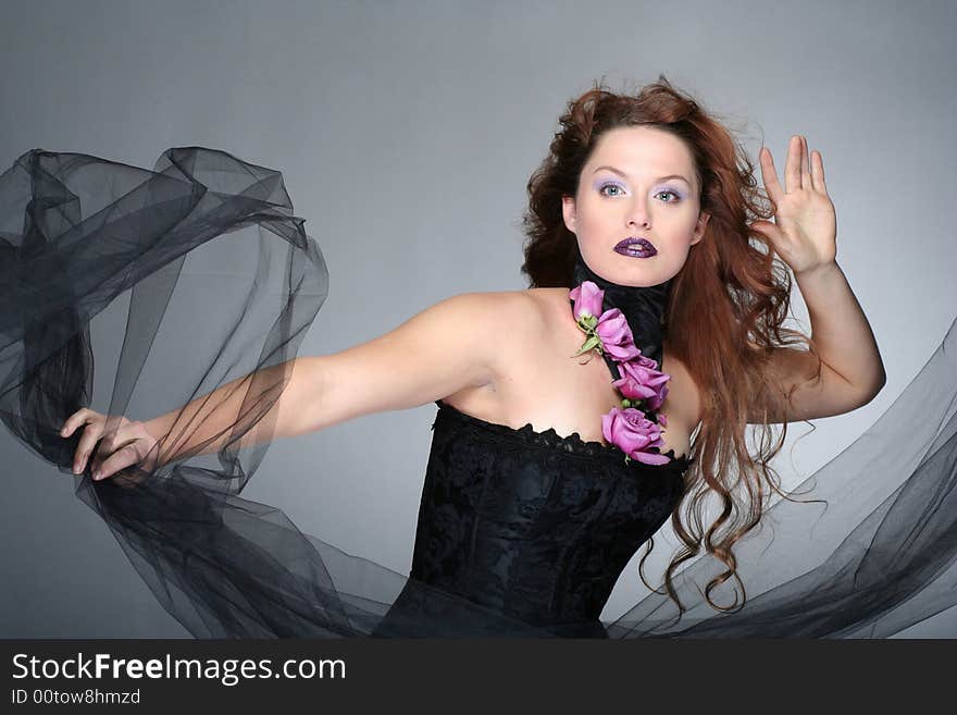 Portrait of young woman with red hair