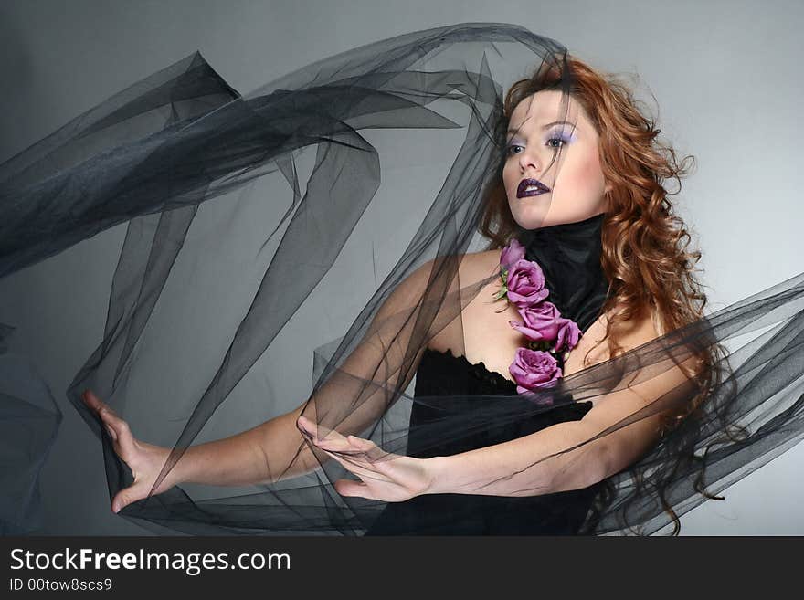 Portrait of young woman with red hair