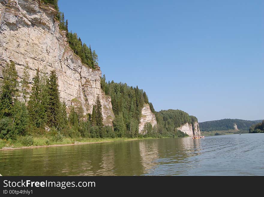 Hight mountains on small river. Hight mountains on small river