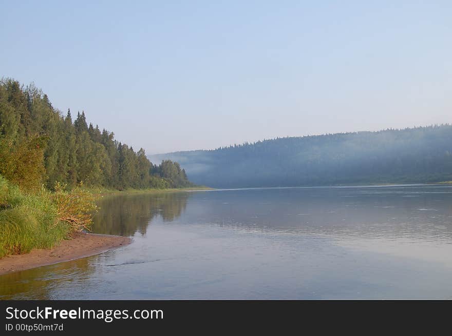 Hight mountains on small river. Hight mountains on small river