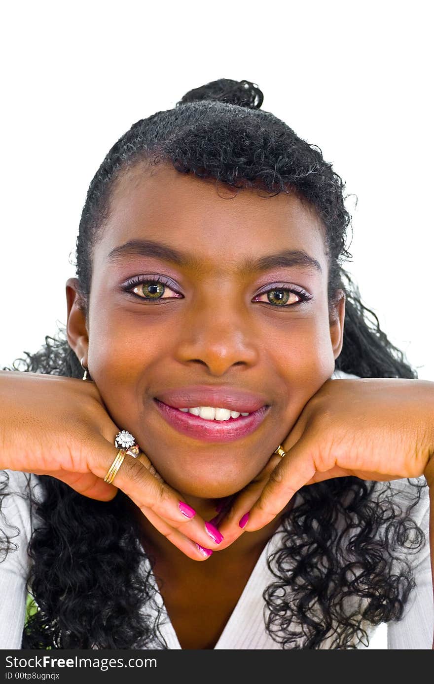 Beautiful african girl face resting on her hands and smiling. Beautiful african girl face resting on her hands and smiling