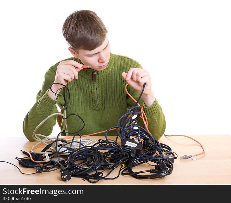 The young guy with cables isolated on a white