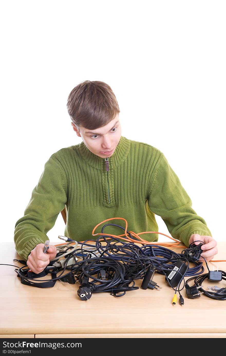 The young guy with cables isolated on a white