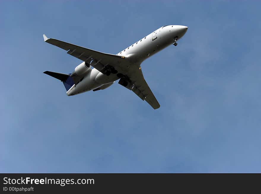 Regional passenger airplane few moments after take-off. Regional passenger airplane few moments after take-off