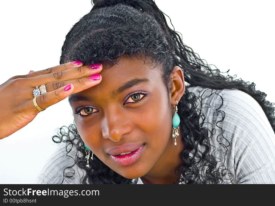 Nice green-eyed girl touching her forehead