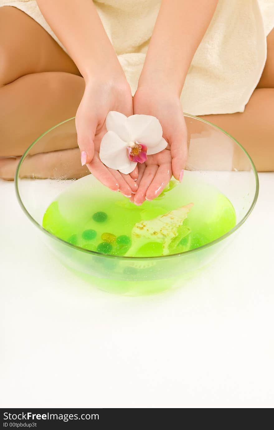 Girl washing hands in aroma water