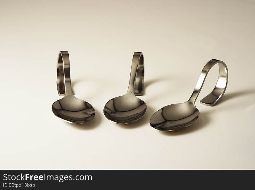 Three amuse-bouche party spoons lined up in a row. Three amuse-bouche party spoons lined up in a row