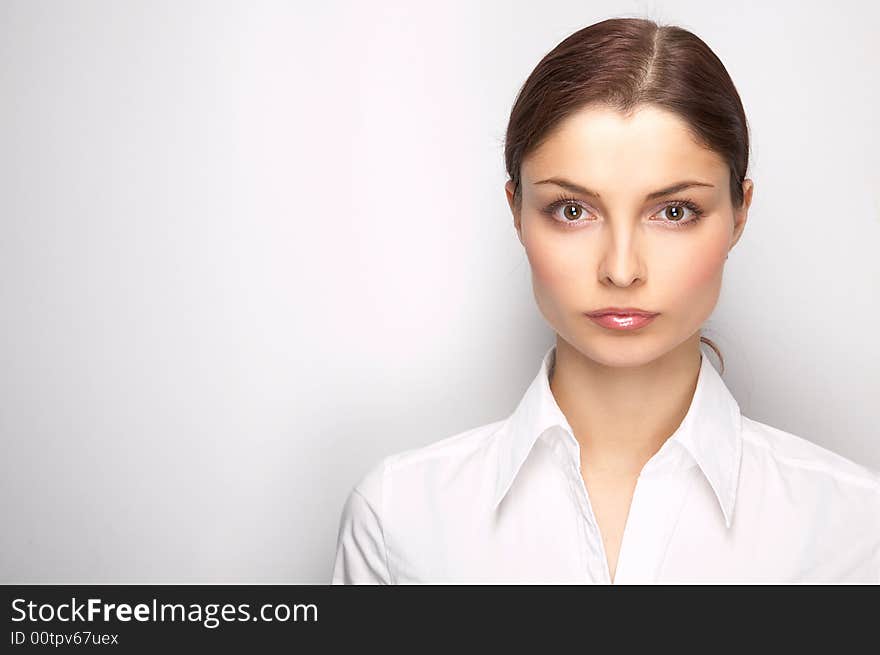 Young woman on the white background