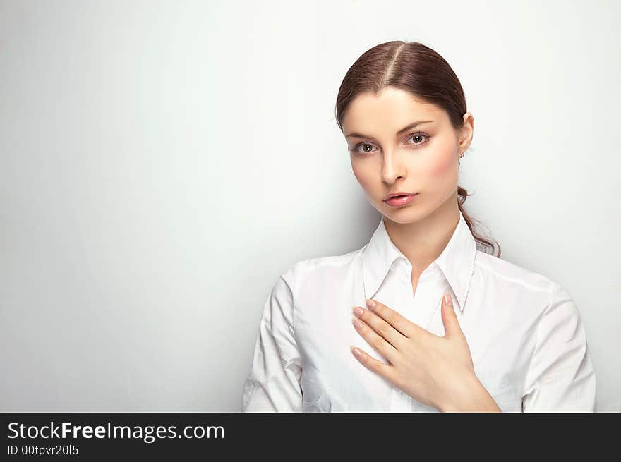 Young woman on the white background