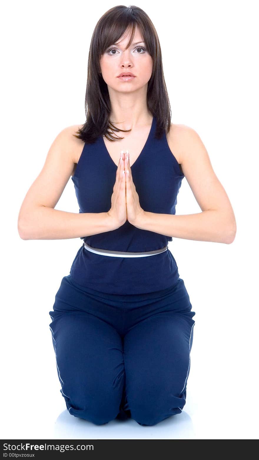 Nice young woman doing yoga exercise