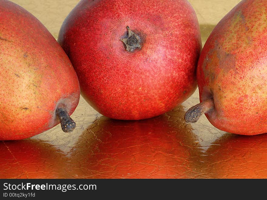 Trio of red pears