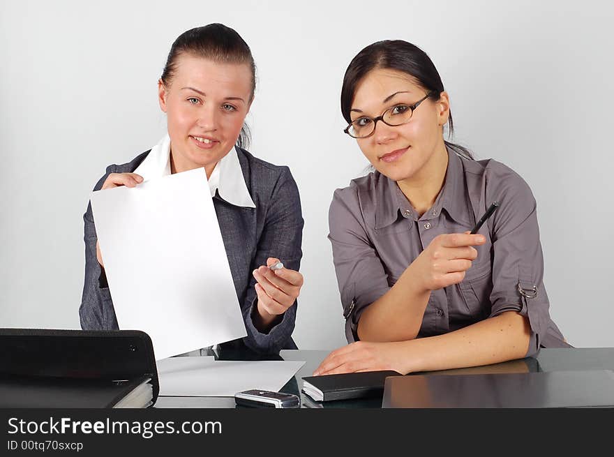 Attractive brunette women  working in office. Attractive brunette women  working in office