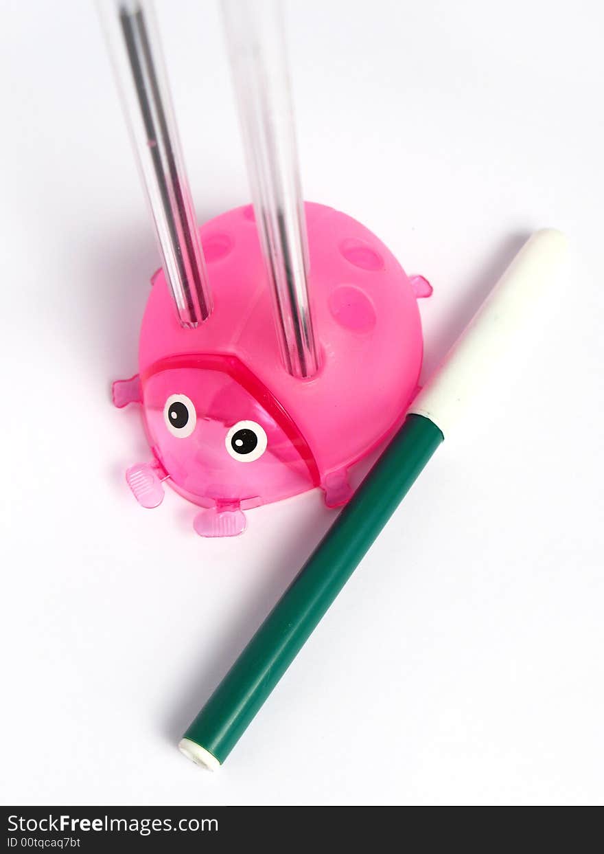 Pink Ladybug Pencil Holder, with pens and marker on white background