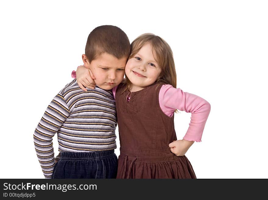 Children on a white background, the joyful girl embraces the sad boy. Children on a white background, the joyful girl embraces the sad boy