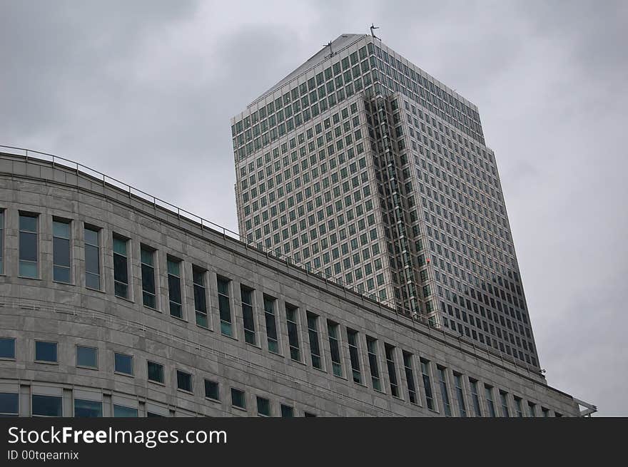 London Canary Wharf skycraper with a cloudy sky. London Canary Wharf skycraper with a cloudy sky