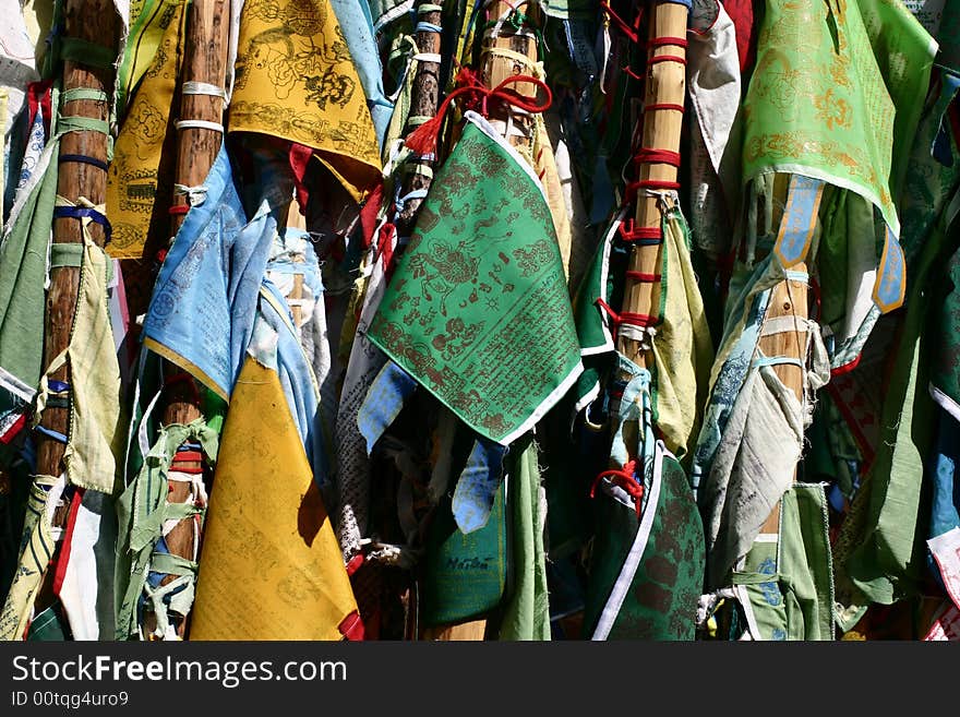 A lot of buddhist flags tied to poles in siberia named imorin