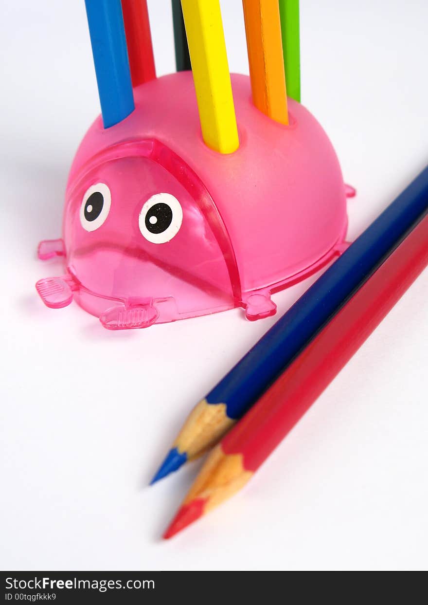 Pink Ladybug Pencil Holder, with pencils on white background