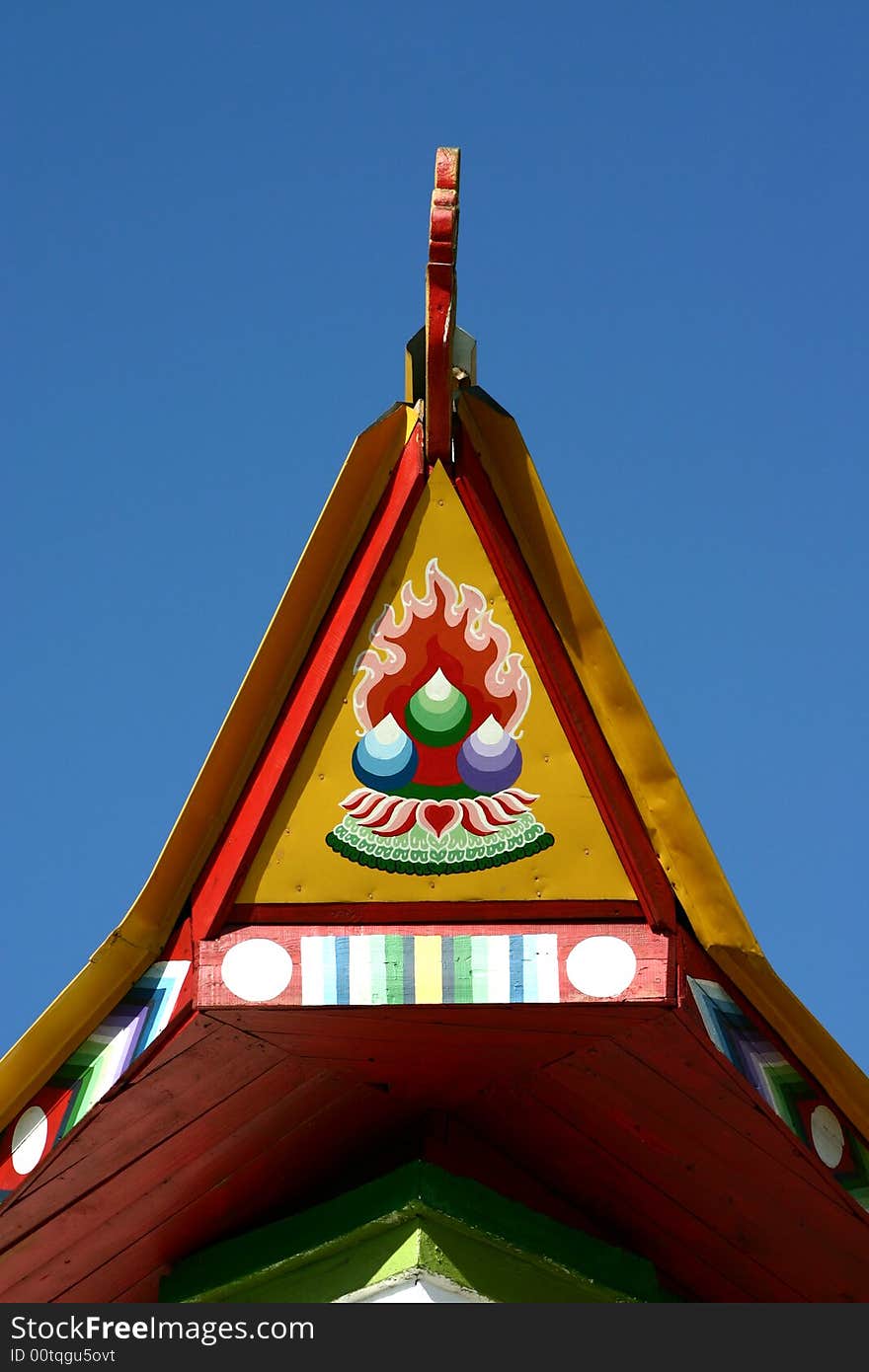 The top of a buddhist temple in a blue sky in siberia