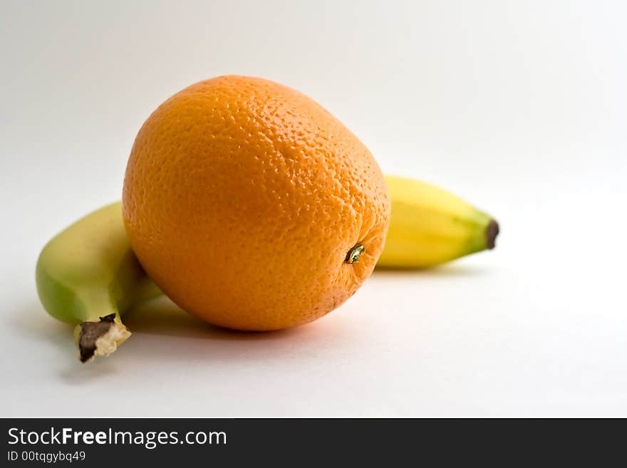 Isolated orange with banana on white background. Isolated orange with banana on white background