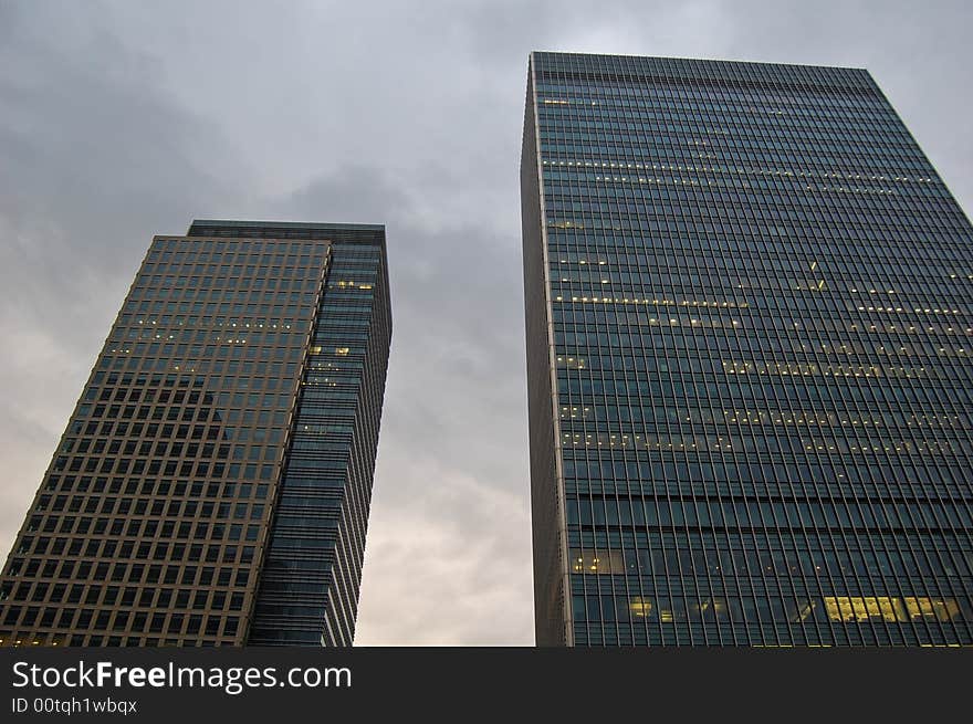 London Canary Wharf skycraper with a cloudy sky. London Canary Wharf skycraper with a cloudy sky