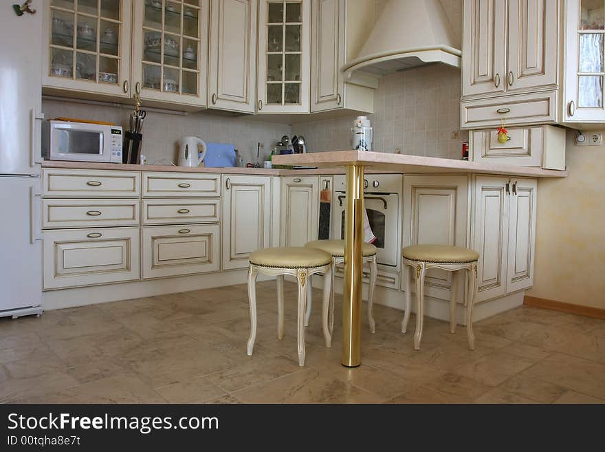 Interior Of Kitchen With A Table And Tablewares In