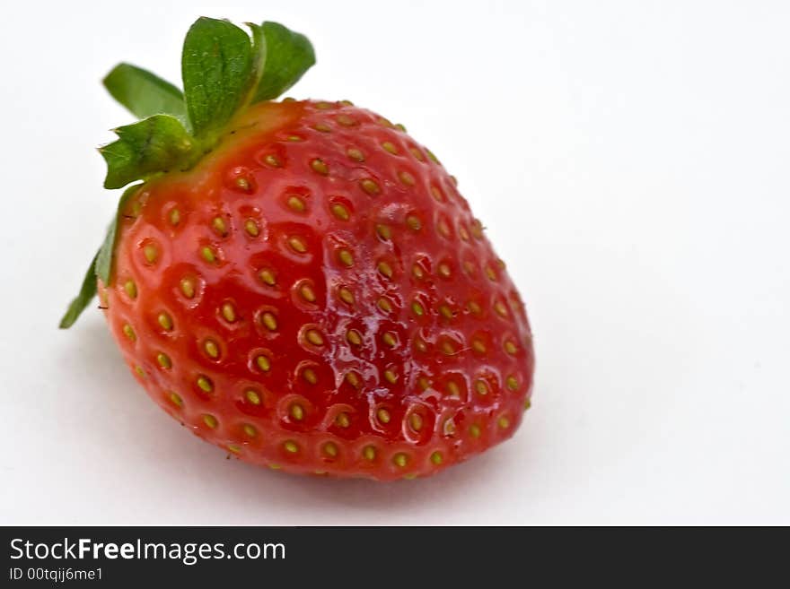 One isolated  fresh strawberry on white background. One isolated  fresh strawberry on white background