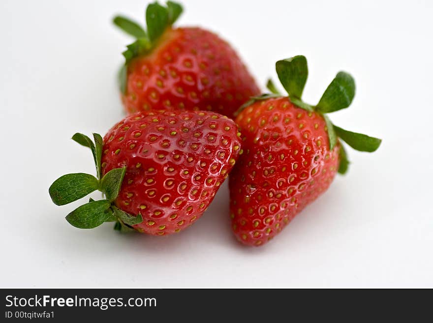 Three strawberries on white background, isolated