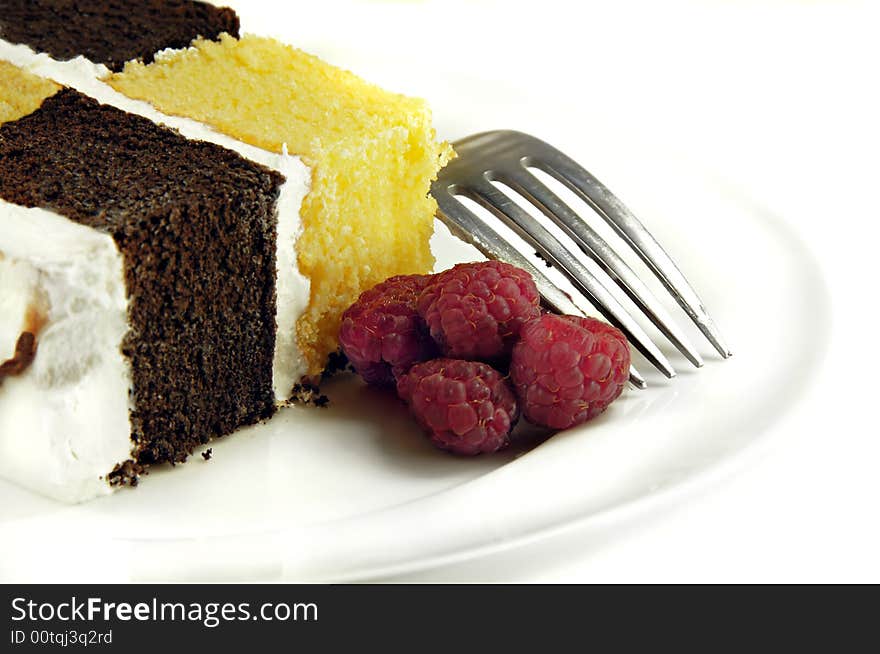 Checkerboard Cake with Raspberries on a white background.