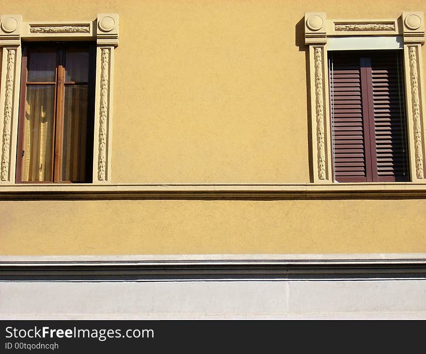 Two windows of an historic building in Milan. Two windows of an historic building in Milan