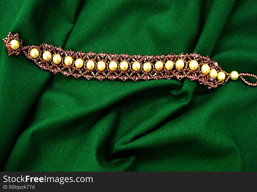 Bracelet on green background