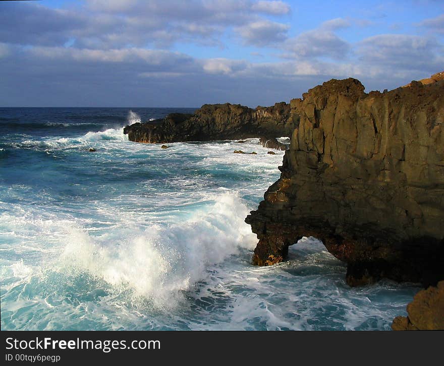 Sunset evening sky over stormy rock and water of Atlantic ocean. Sunset evening sky over stormy rock and water of Atlantic ocean