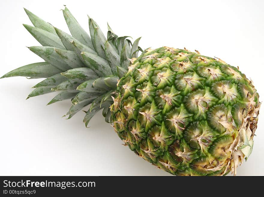 Fresh pineapple ready to be sliced for desert or salad