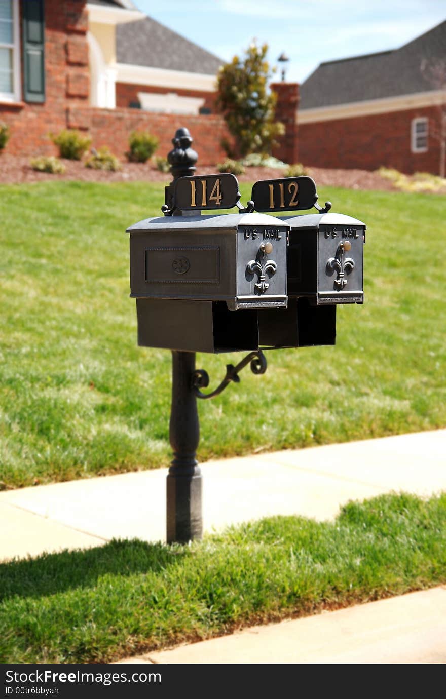 Two mailboxes on roadside.