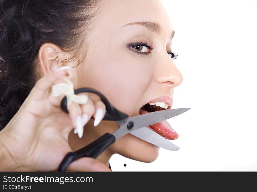 A portrait of beautiful brunette with scissors on white background. A portrait of beautiful brunette with scissors on white background