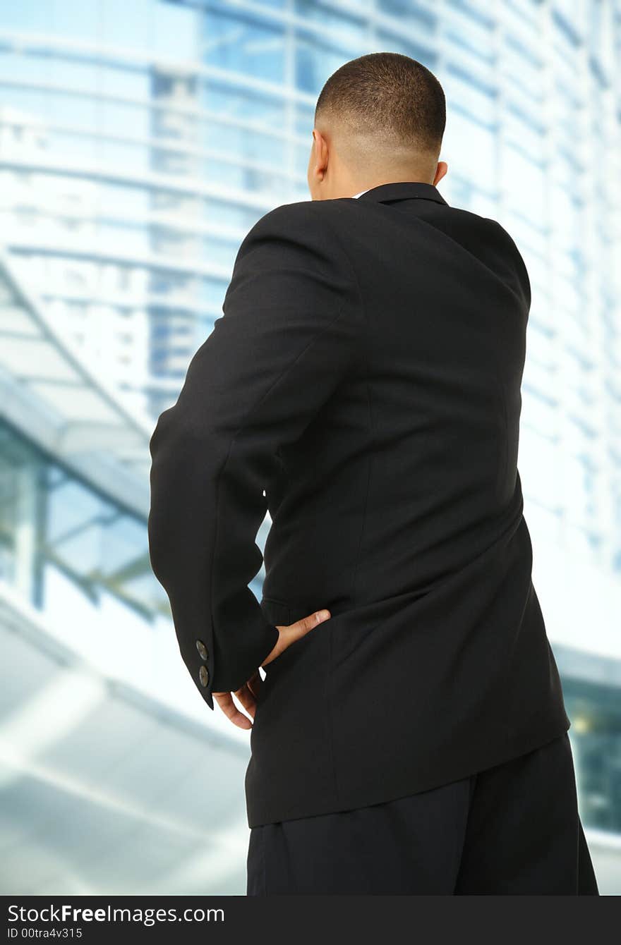 A business man looking at tall modern building outdoor. A business man looking at tall modern building outdoor