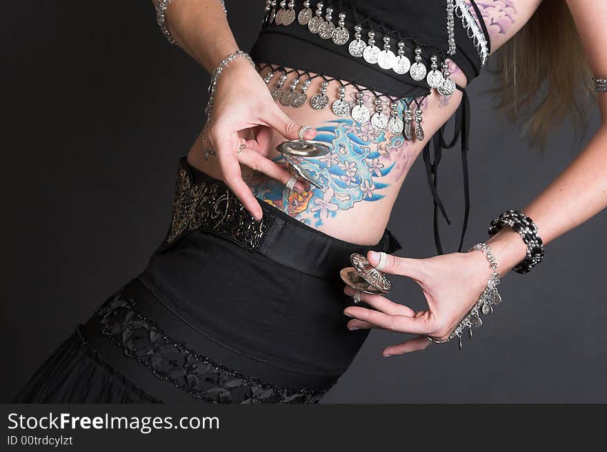 Belly Dancer hands holding Tribal Zagat or finger symbols