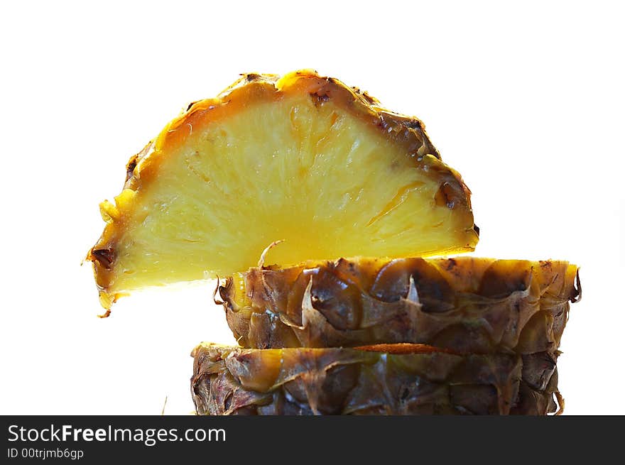 Pineapple cut on a part  on a white background