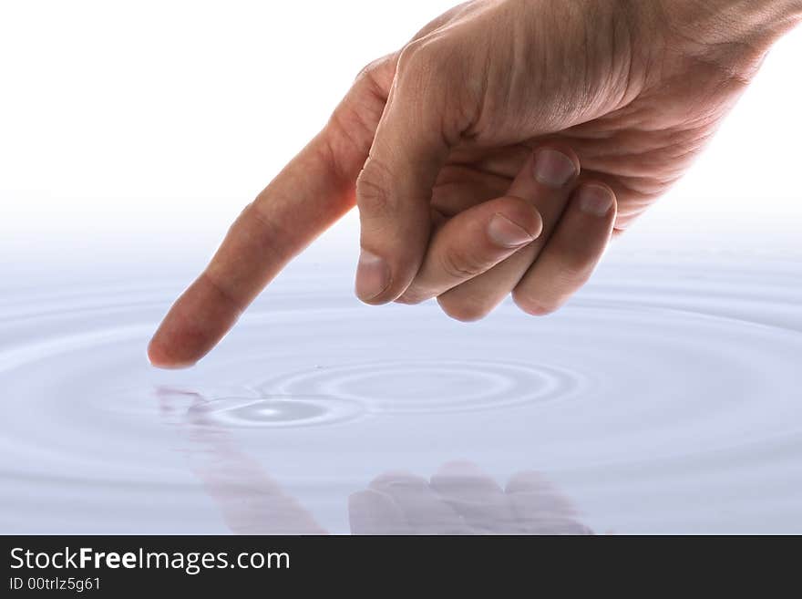 Human hand creating a wave of water, splash