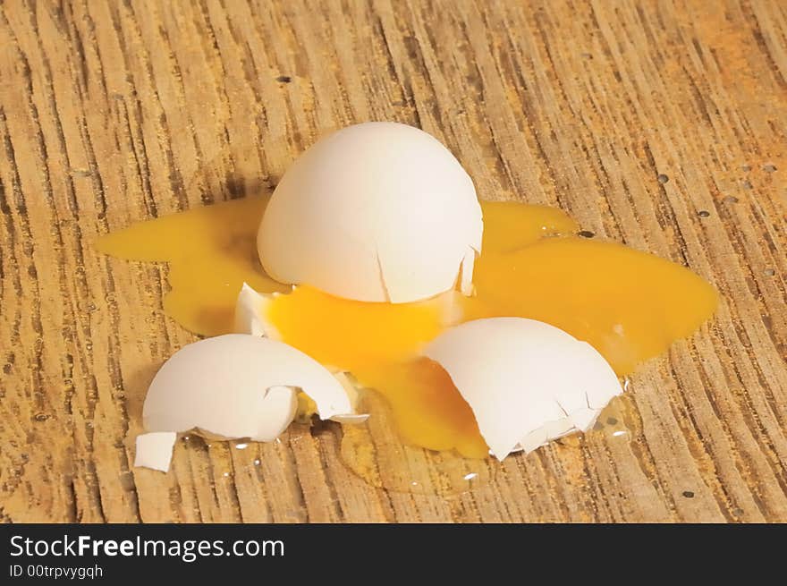 The  broken egg  on a floor