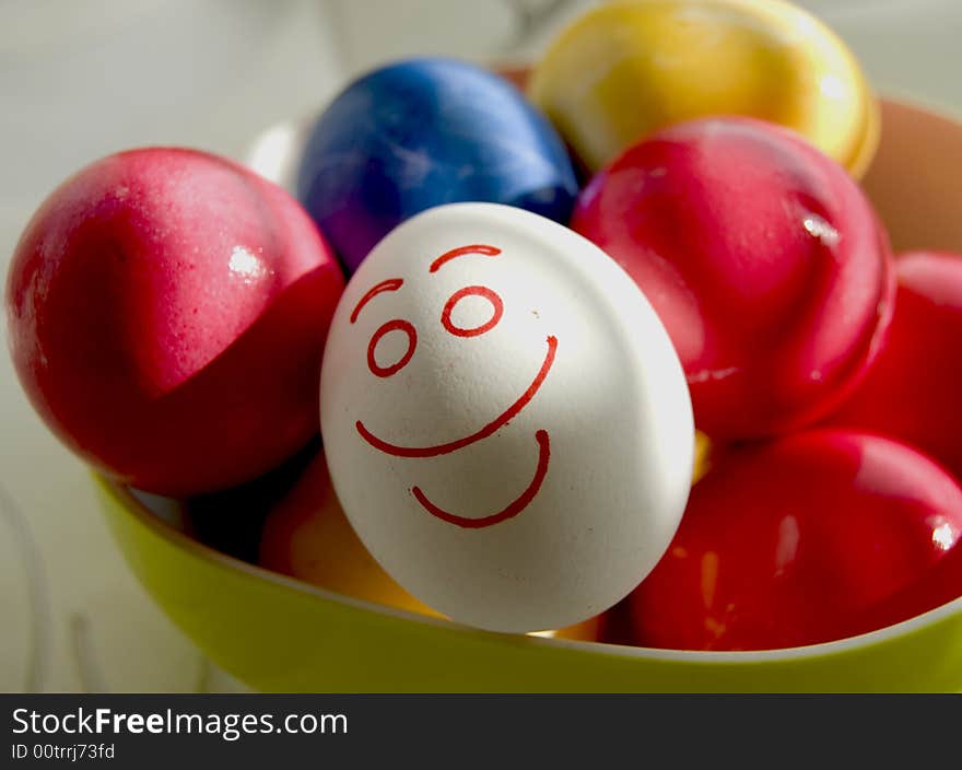 Easters smile eggs in the plate