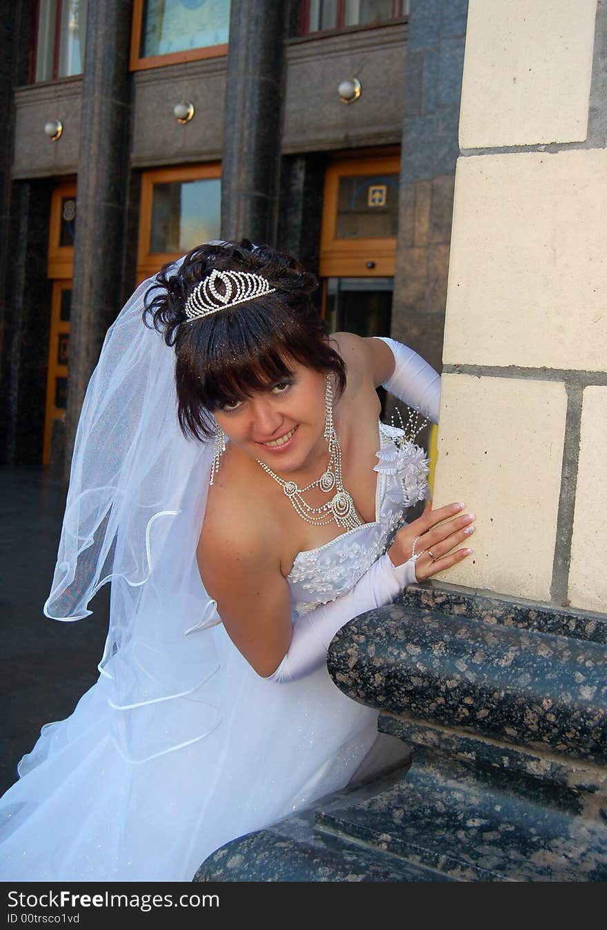 Beautiful bride watching from the corner