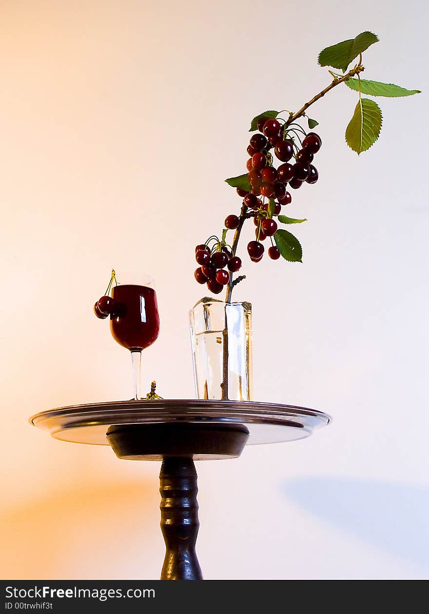 Object abstract,arangement cherry in vase to stand.