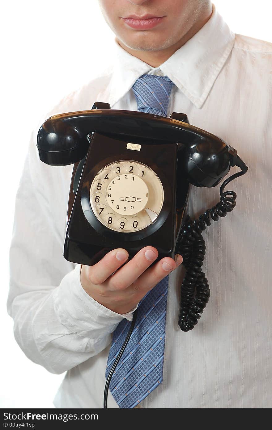 Business man holding an old fashion telephone isolated