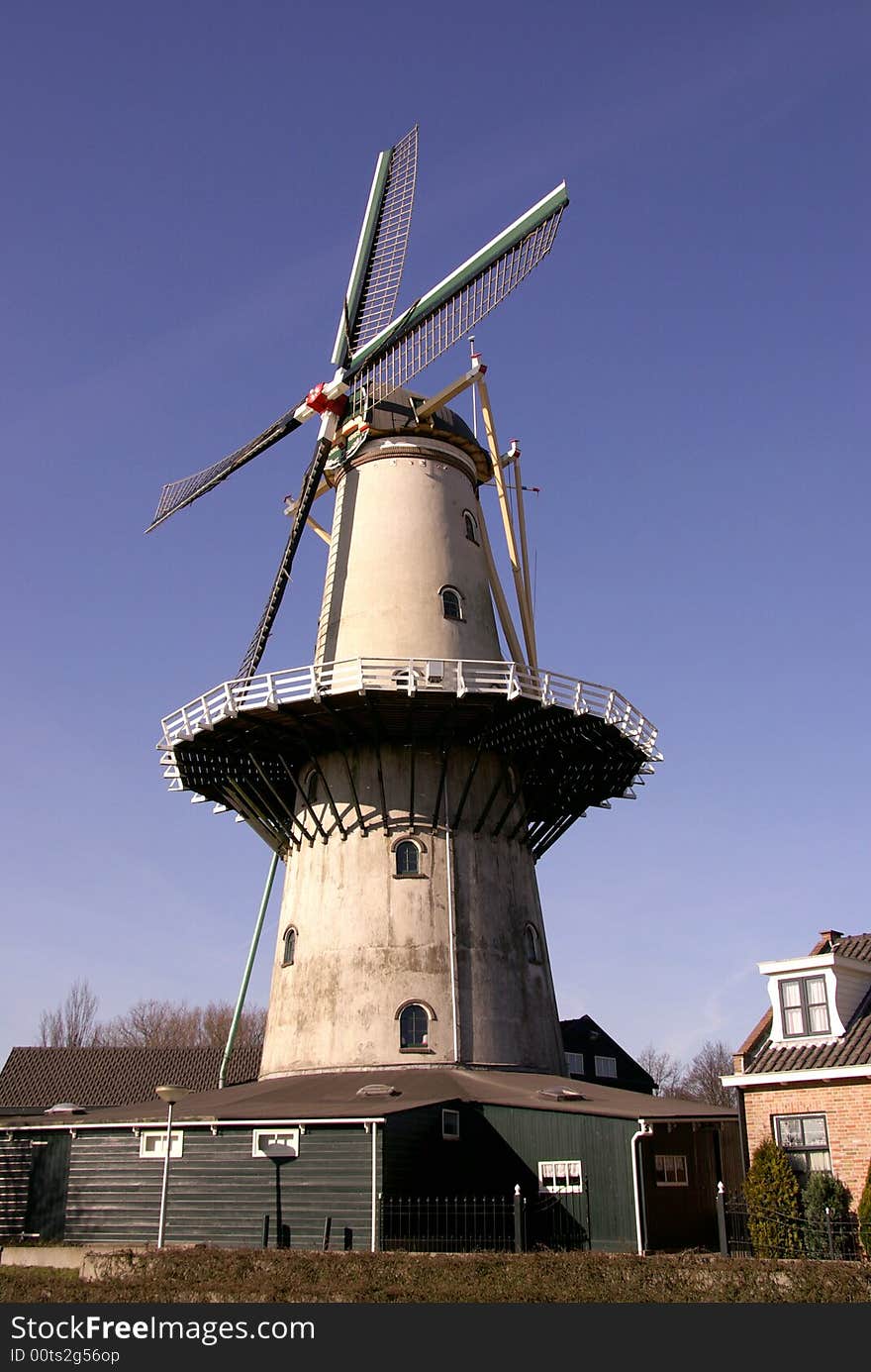 A blue sky and a restored corn-mill. A blue sky and a restored corn-mill