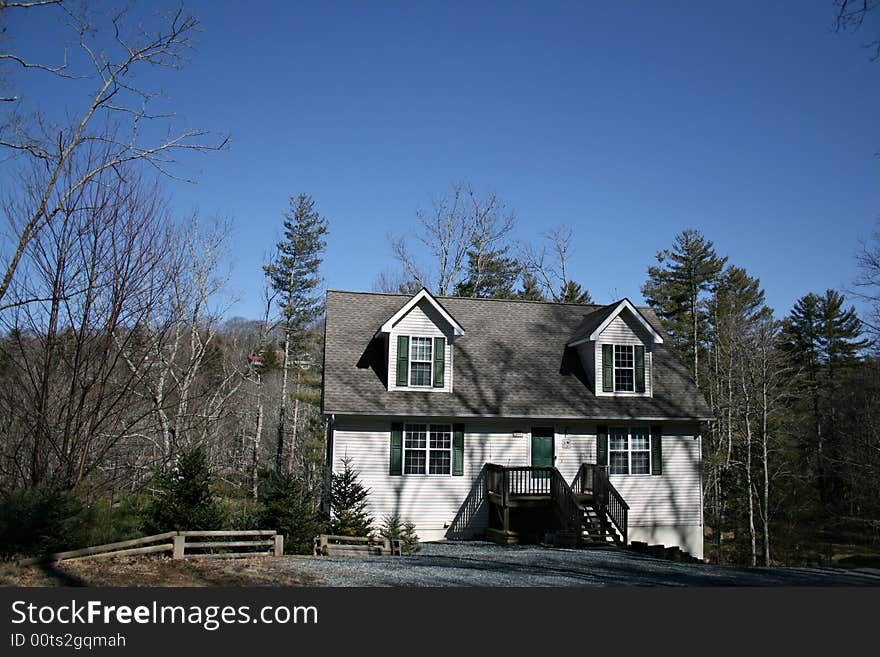 A modern American home with dormer windows. A modern American home with dormer windows.